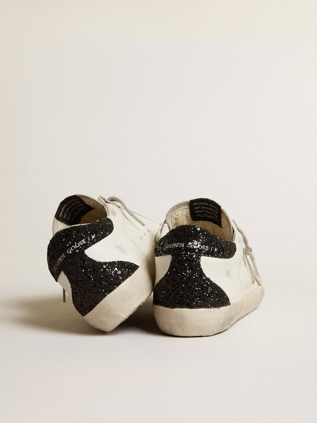 Super-Star con stella oro e talloncino in glitter nero