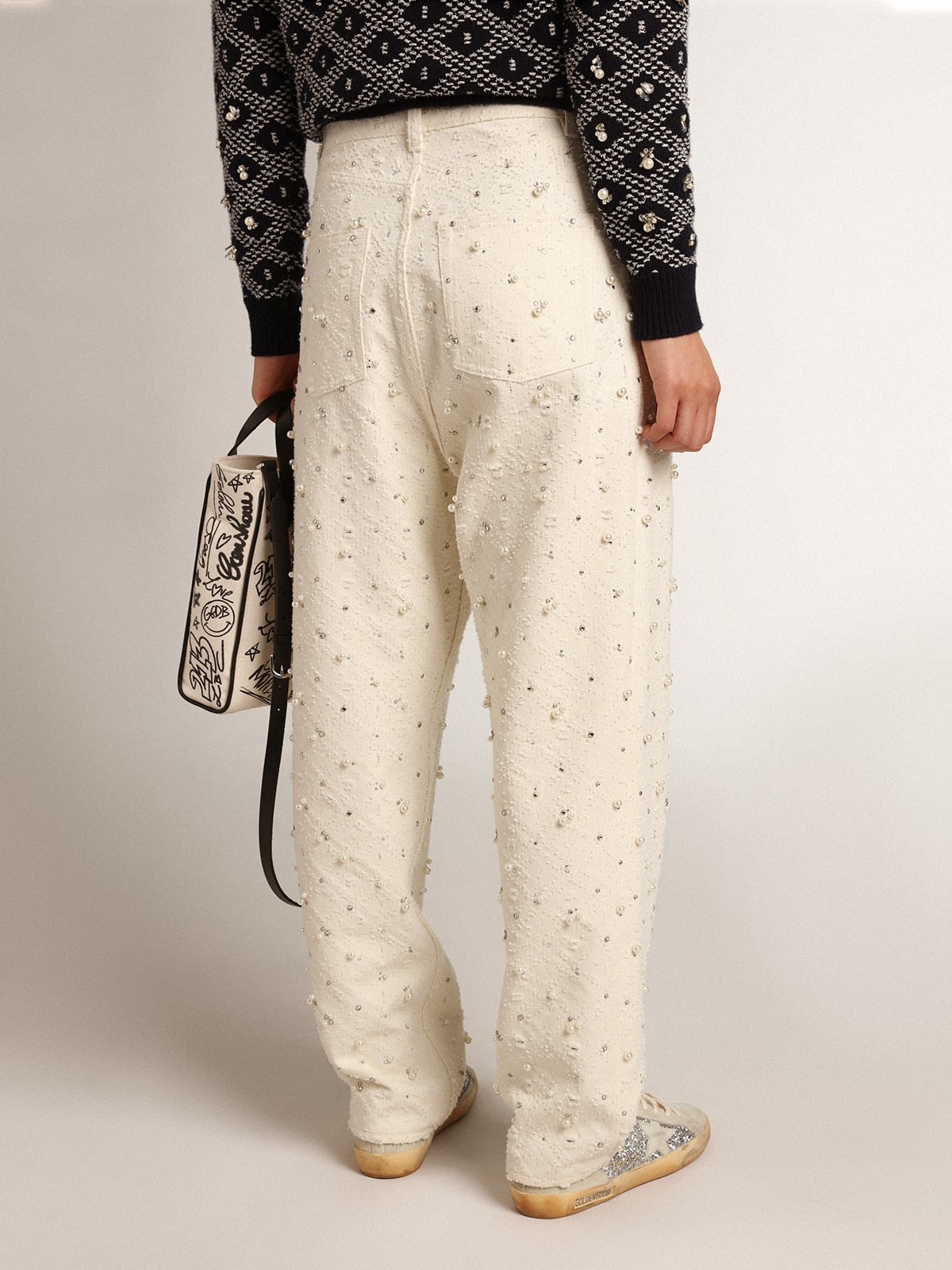 Jeans Kim Collezione Journey in cotone color bianco sporco con motivi a rombi e applicazione di perle e cristalli