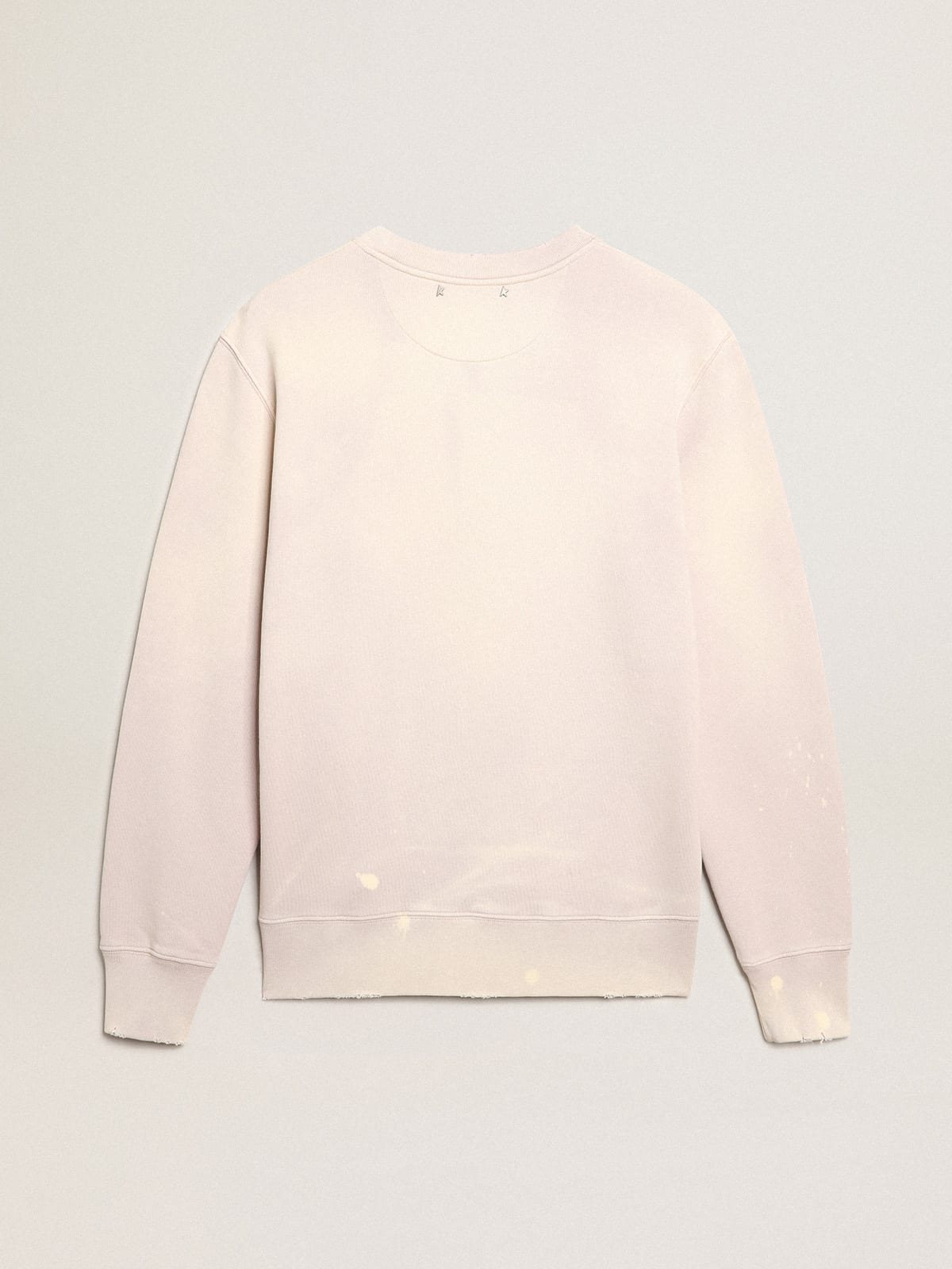 Felpa color rosa pallido dal trattamento distressed