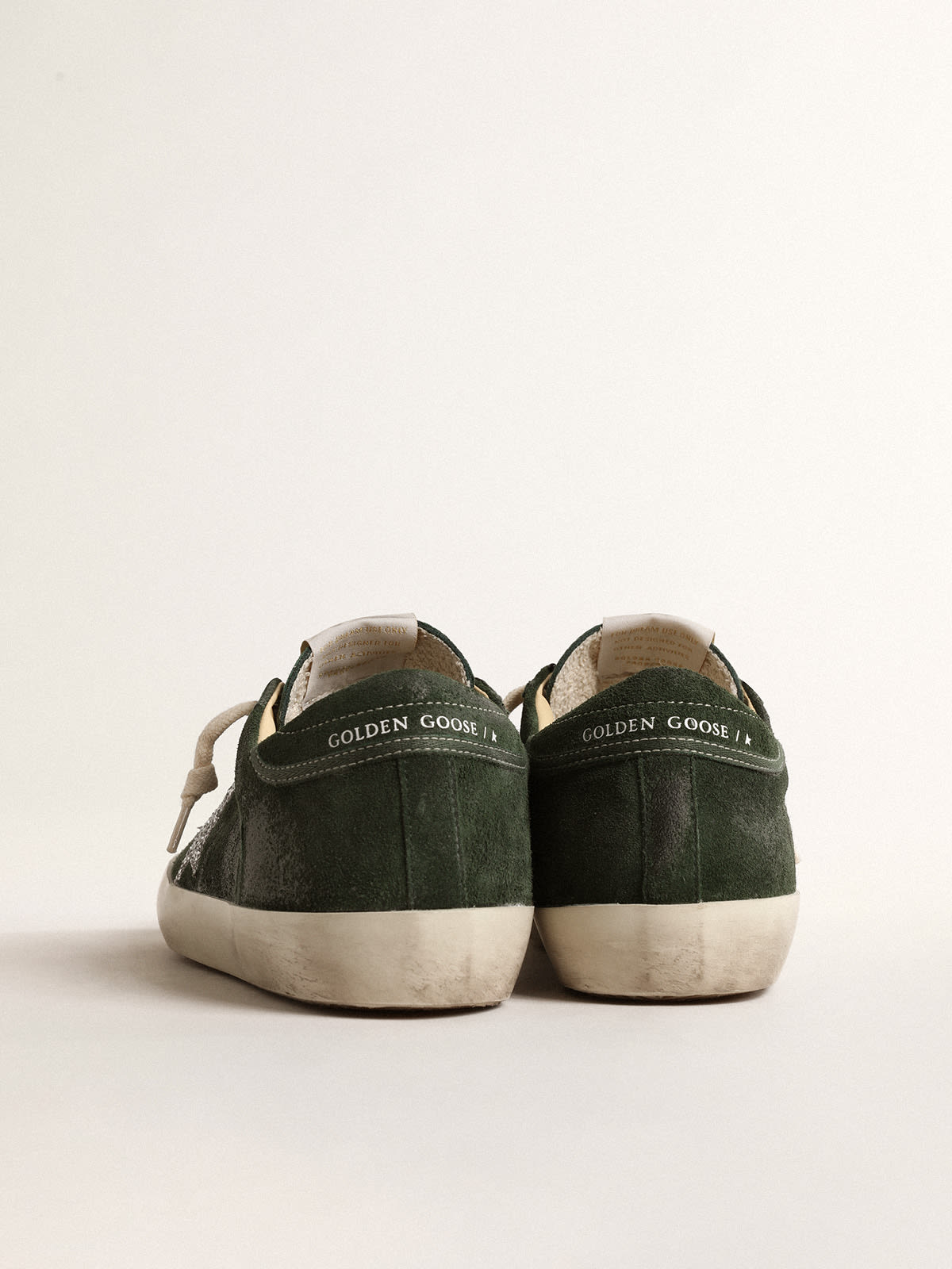 Super-Star LTD in suede verde con stella in glitter argento