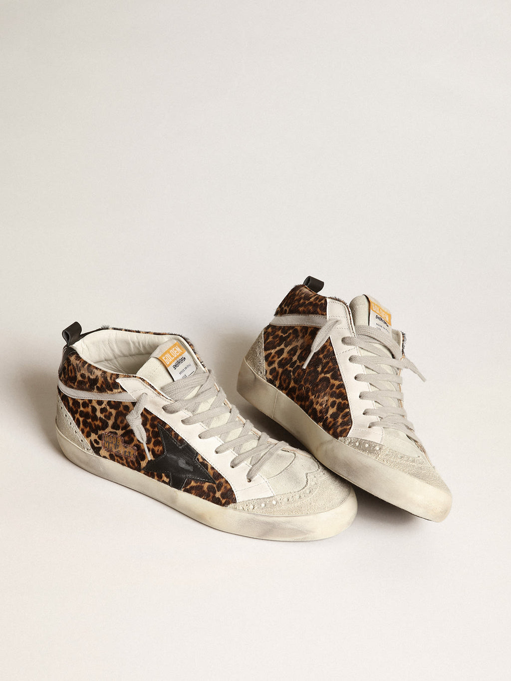 Sneaker Mid Star in cavallino leopardato con stella in pelle nera e virgola in pelle laminata color argento