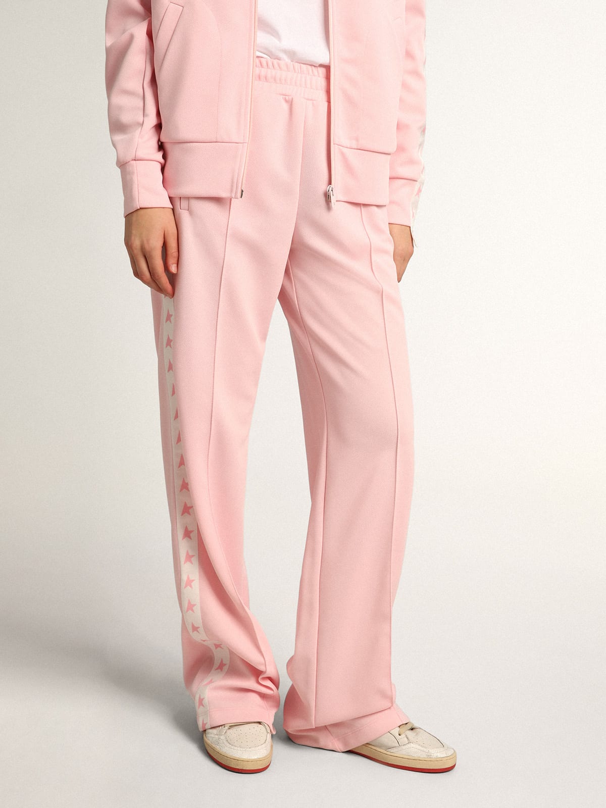Pantalone jogging da donna di colore rosa con stelle rosa sui lati