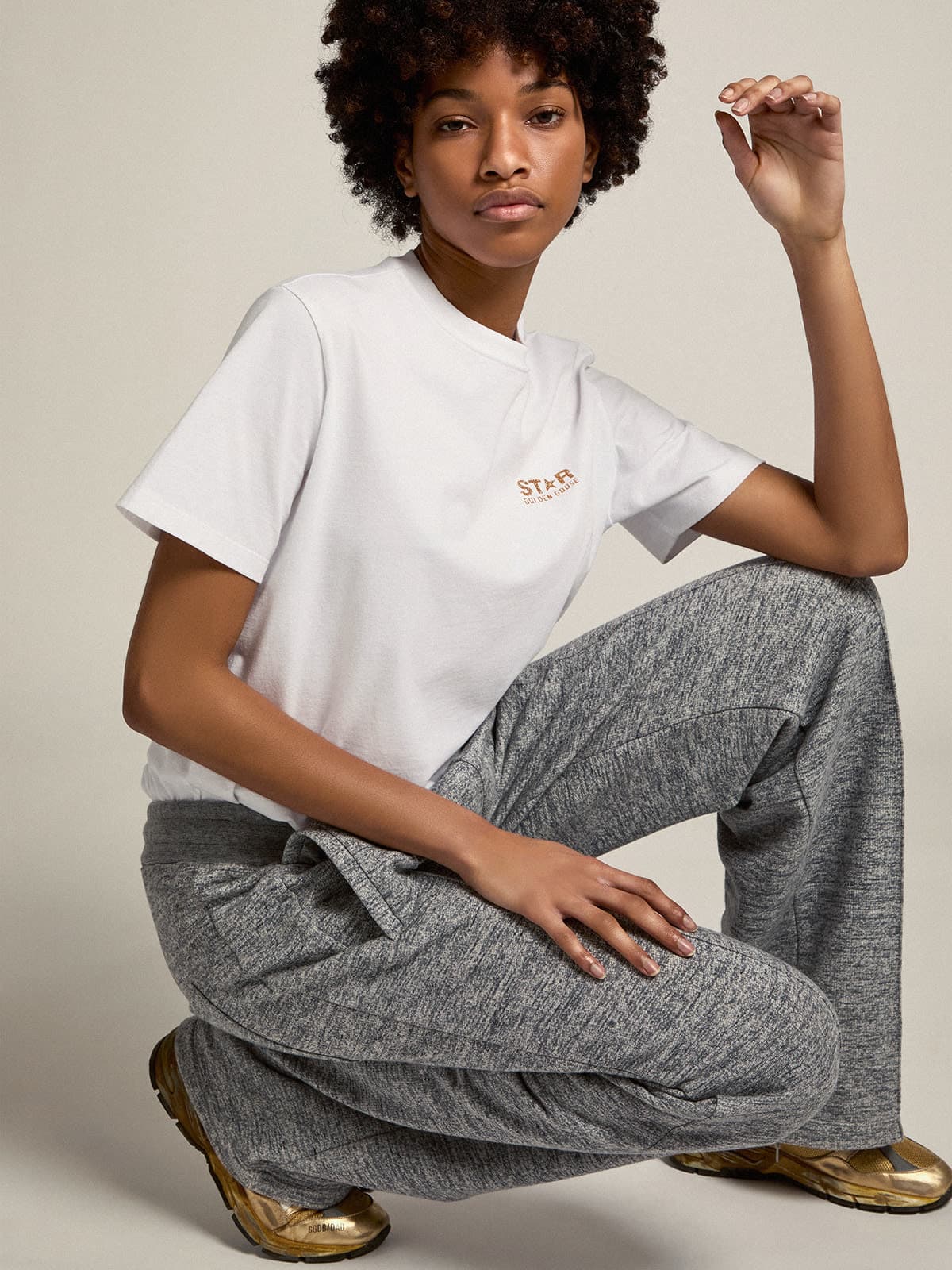 T-shirt bianca Collezion Star con logo e stella in glitter dorati