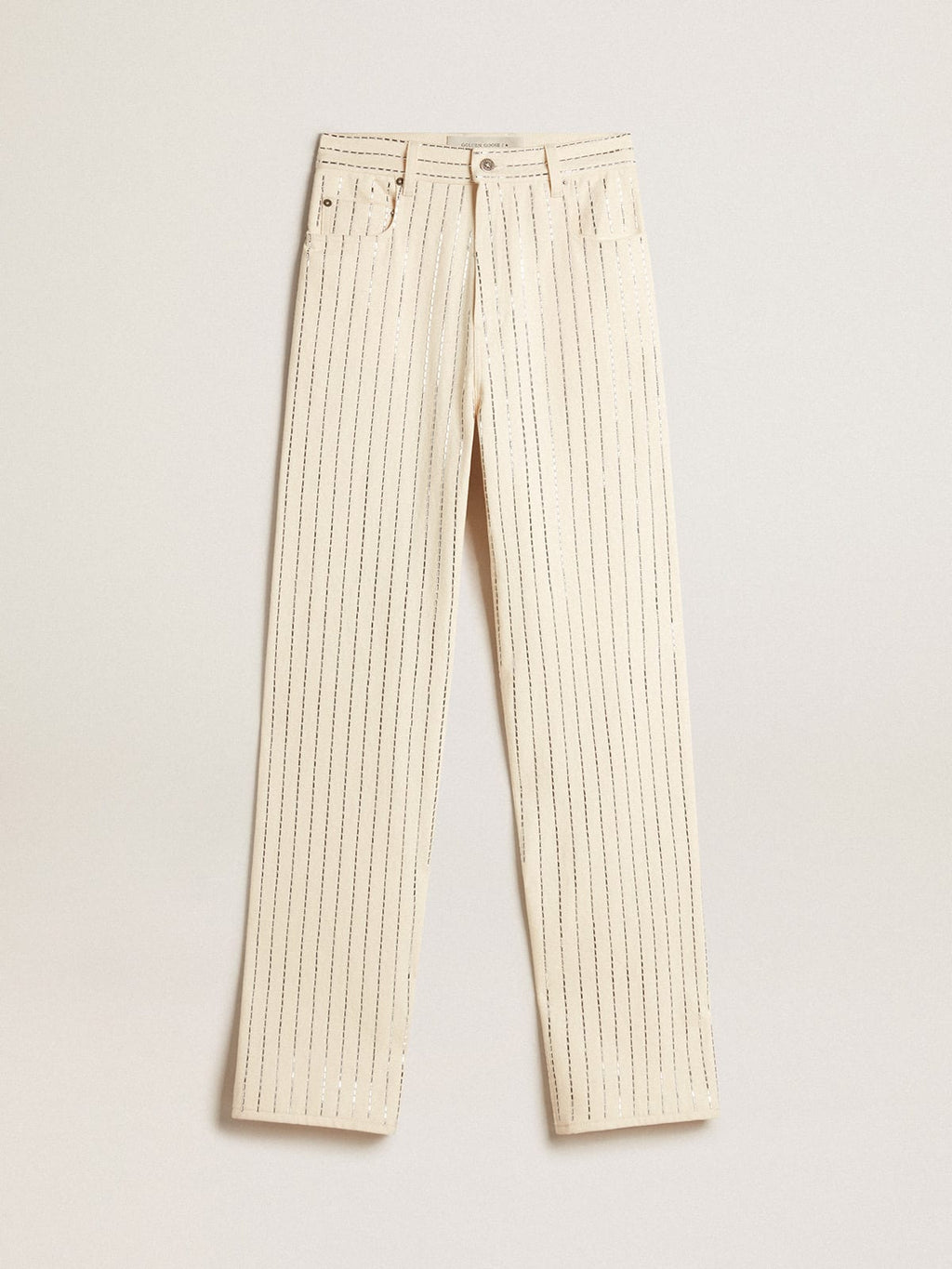 Pantalone di colore bianco con borchie a baguette applicate