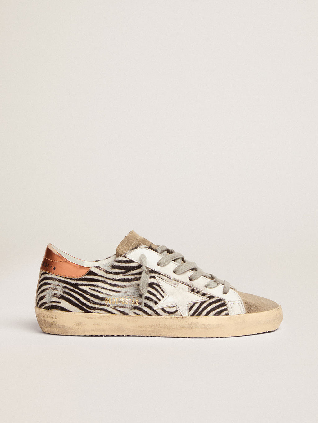 Sneaker Super-Star LTD in cavallino zebrato con stella in pelle bianca e talloncino in pelle laminata color arancione