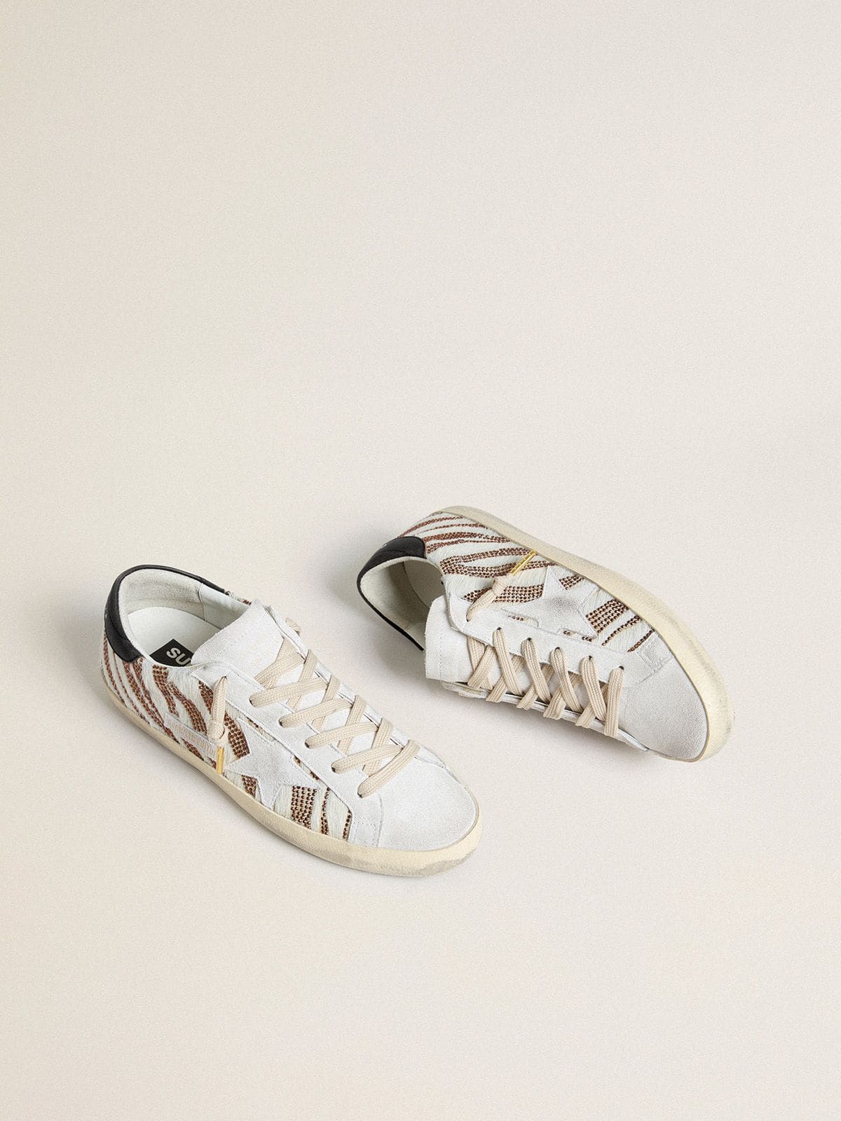 Women’s Super-Star LTD in white pony skin with brown glitter and white suede star