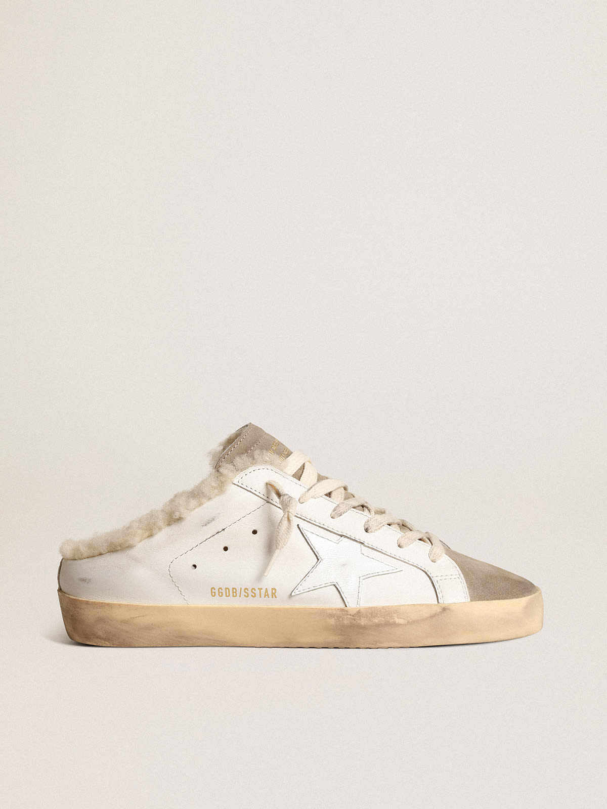 Super-Star Sabot con stella in pelle bianca e fodera in shearling