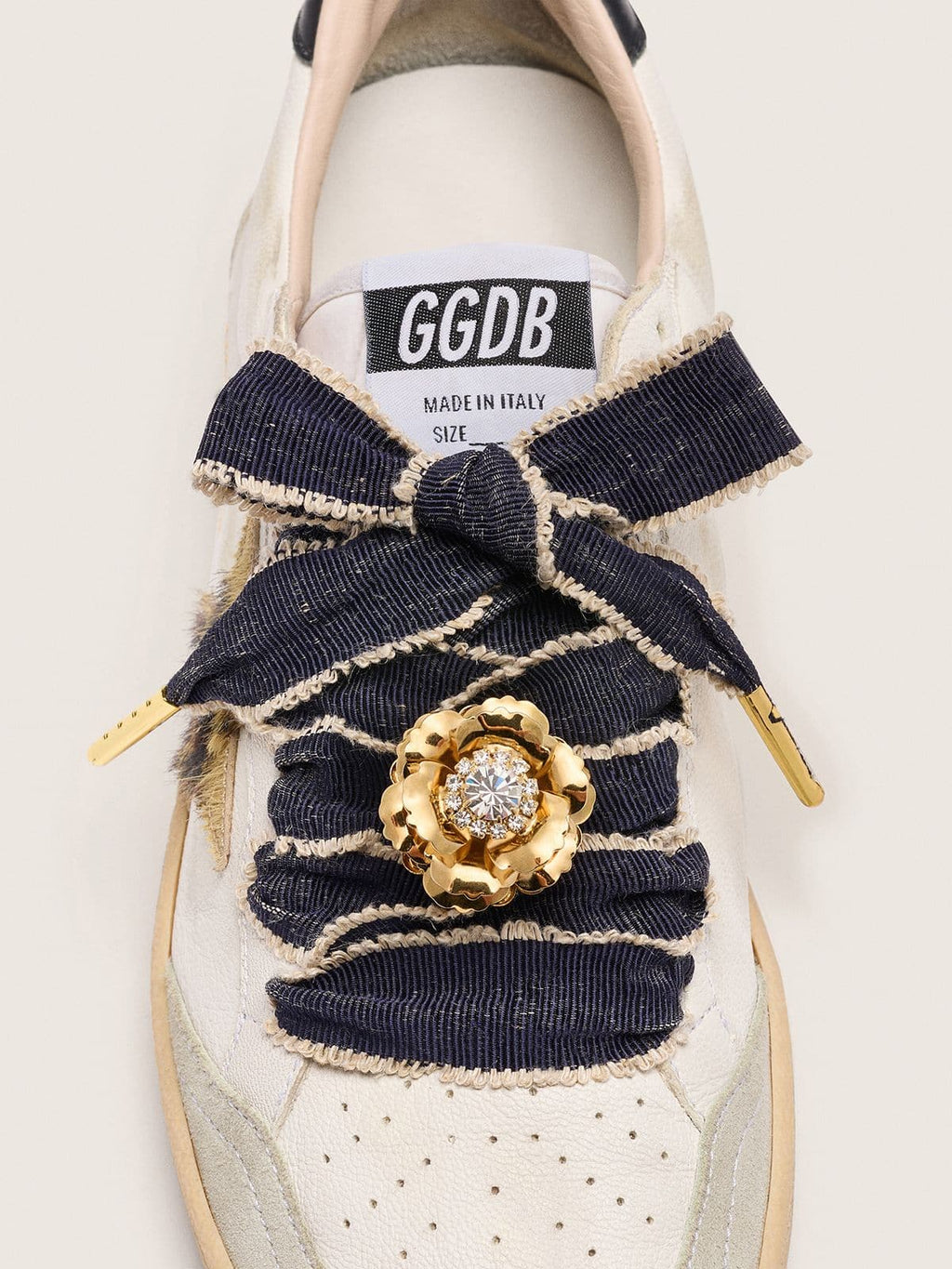 Skins "Sparkling" denim blue laces embellished with beige trim and a golden charm