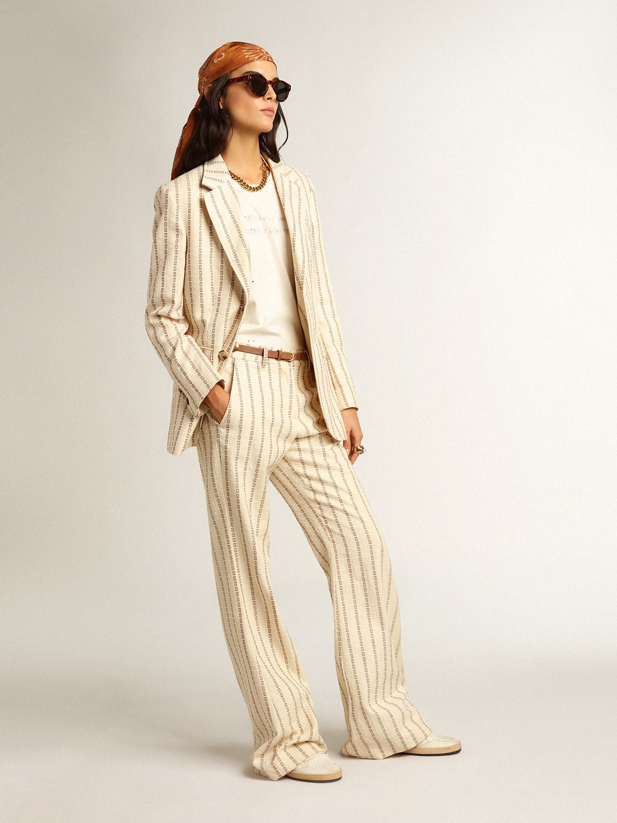 Pantalone in cotone color panna con motivo jacquard