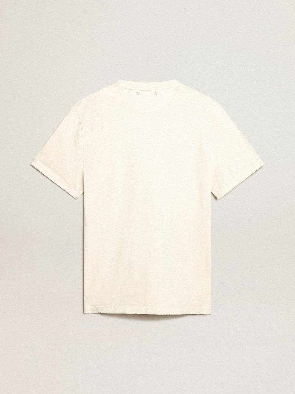 T-shirt di colore bianco dal trattamento distressed con scritta