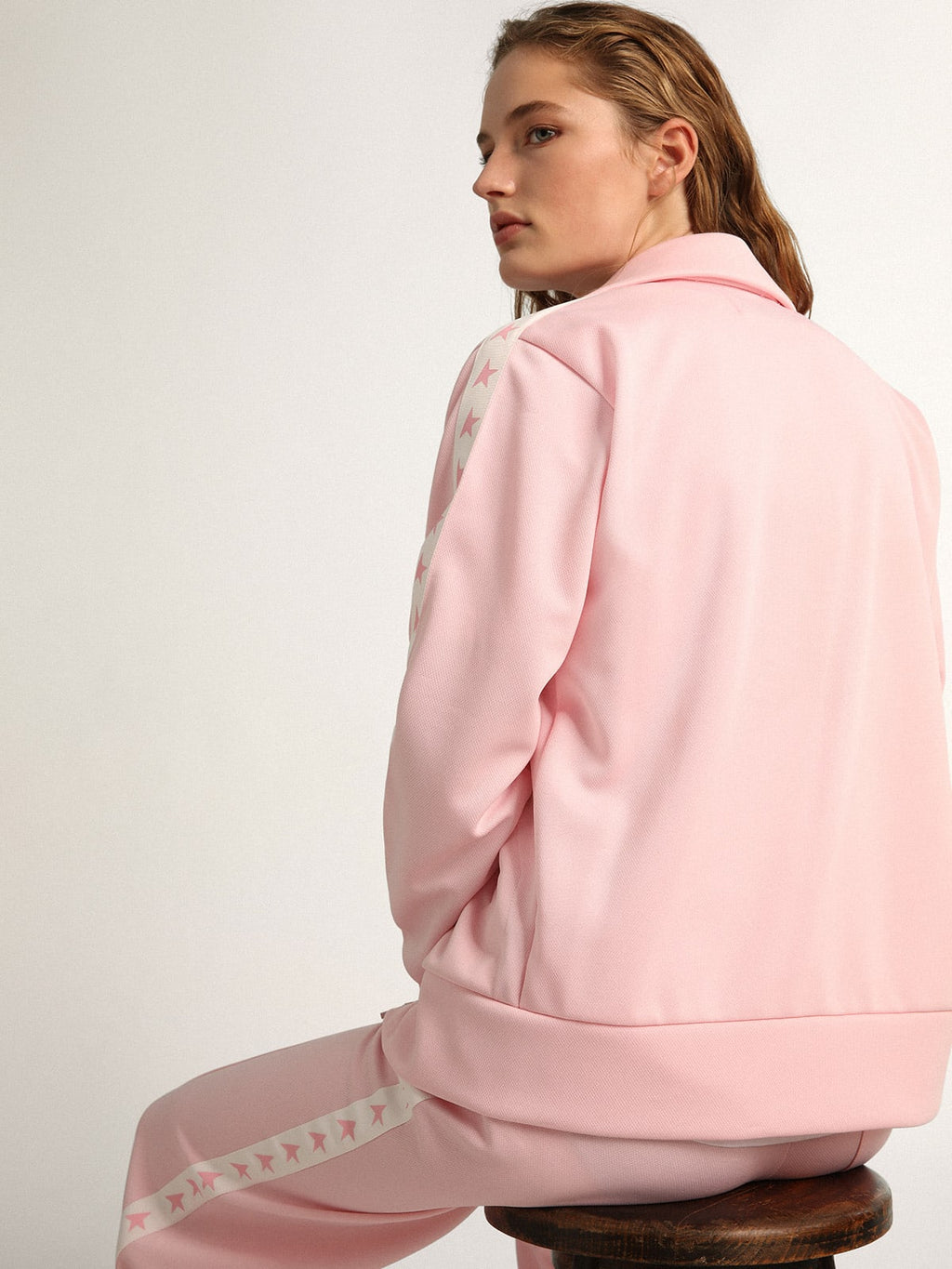 Felpa con zip da donna di colore rosa con stelle rosa a contrasto