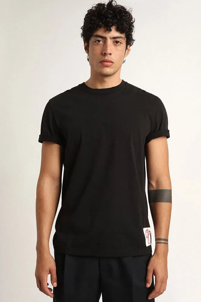 T-shirt Collezione Golden di colore nero vintage dal trattamento distressed
