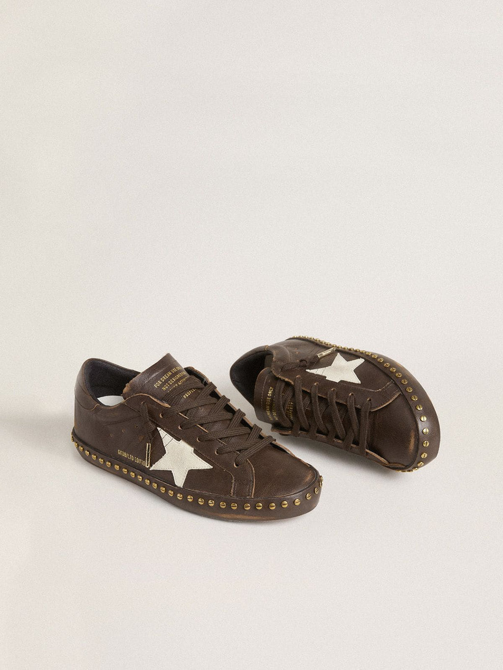 Women’s Super-Star in dark brown leather with cream suede star and studs