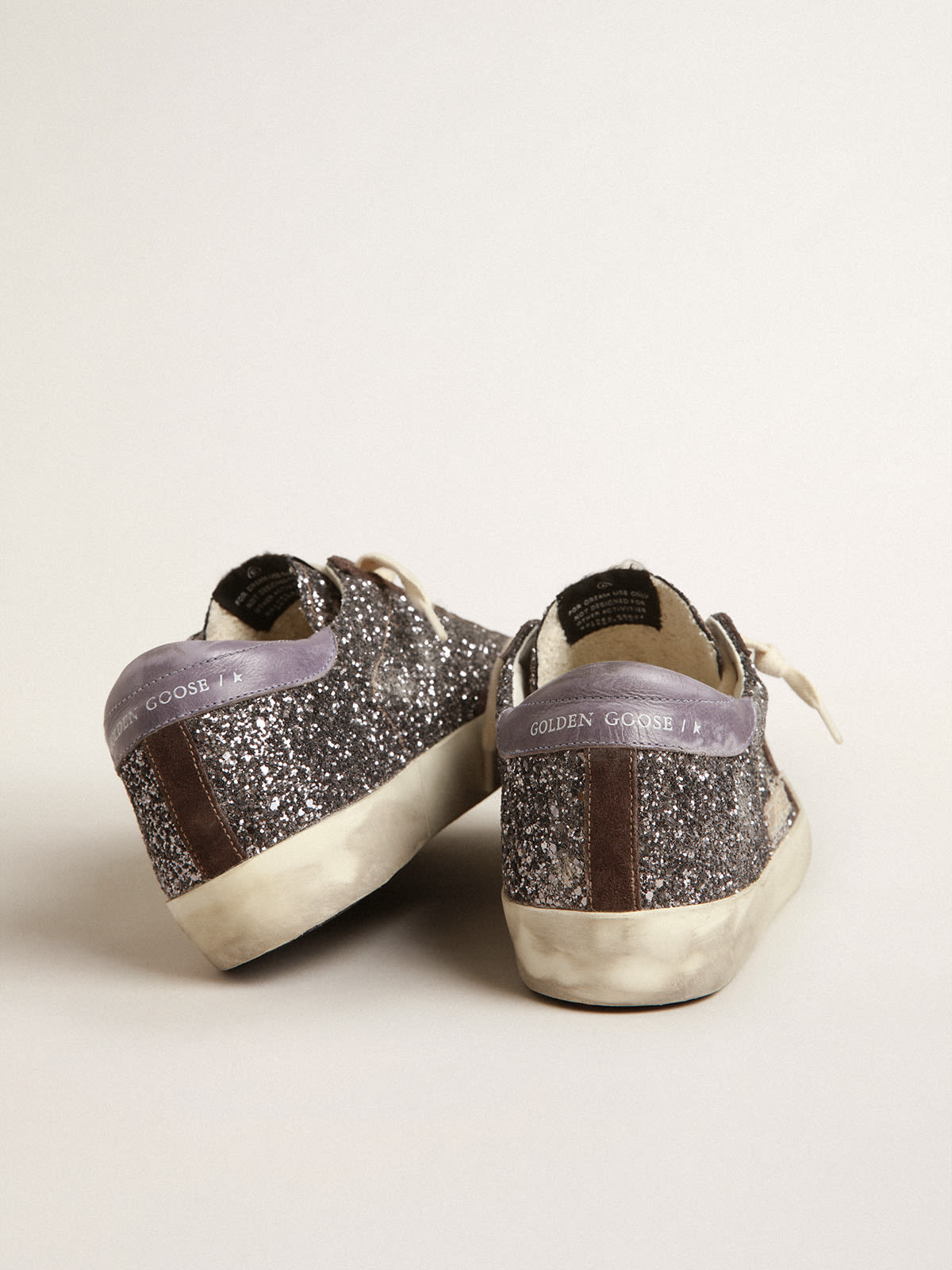 Super-Star in glitter con stella marrone e talloncino lilla