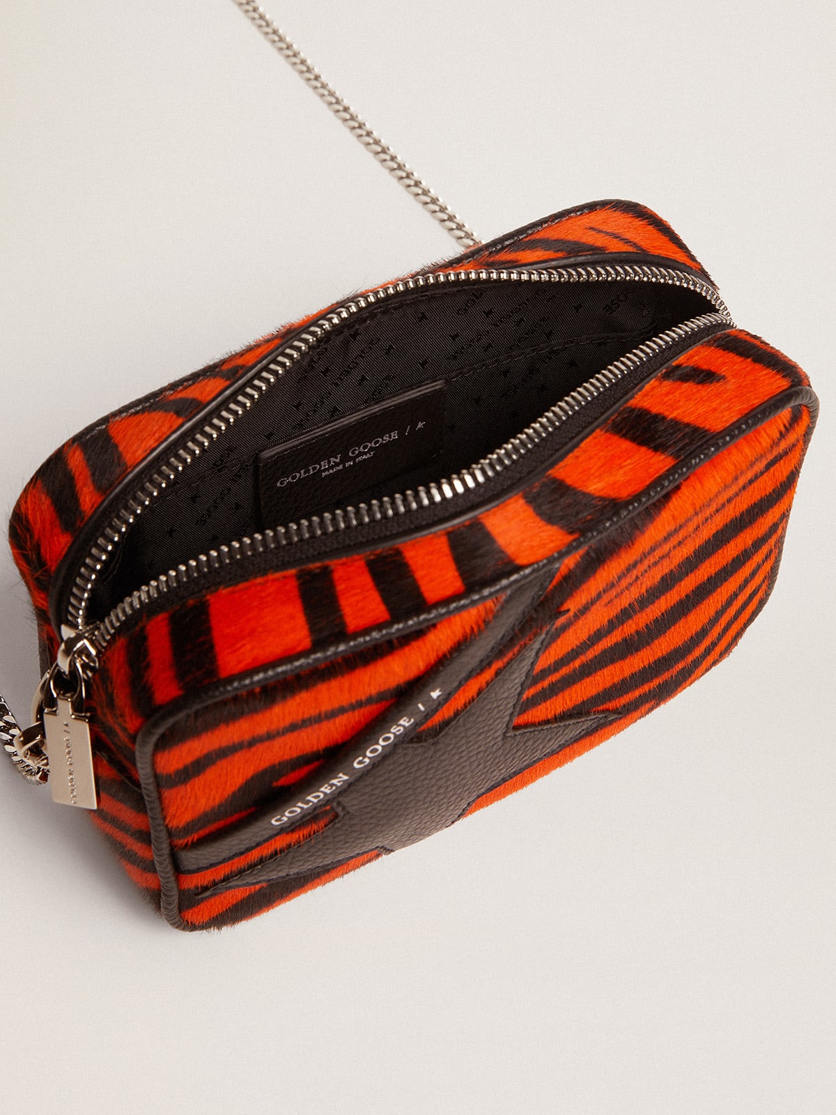 Borsa Mini Star Bag in cavallino tigrato color arancione e stella in pelle nera
