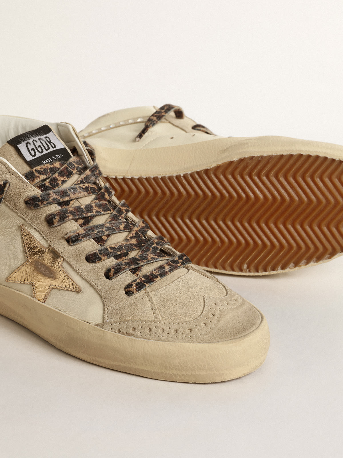 Mid Star con stella in pelle laminata e virgola con cristalli