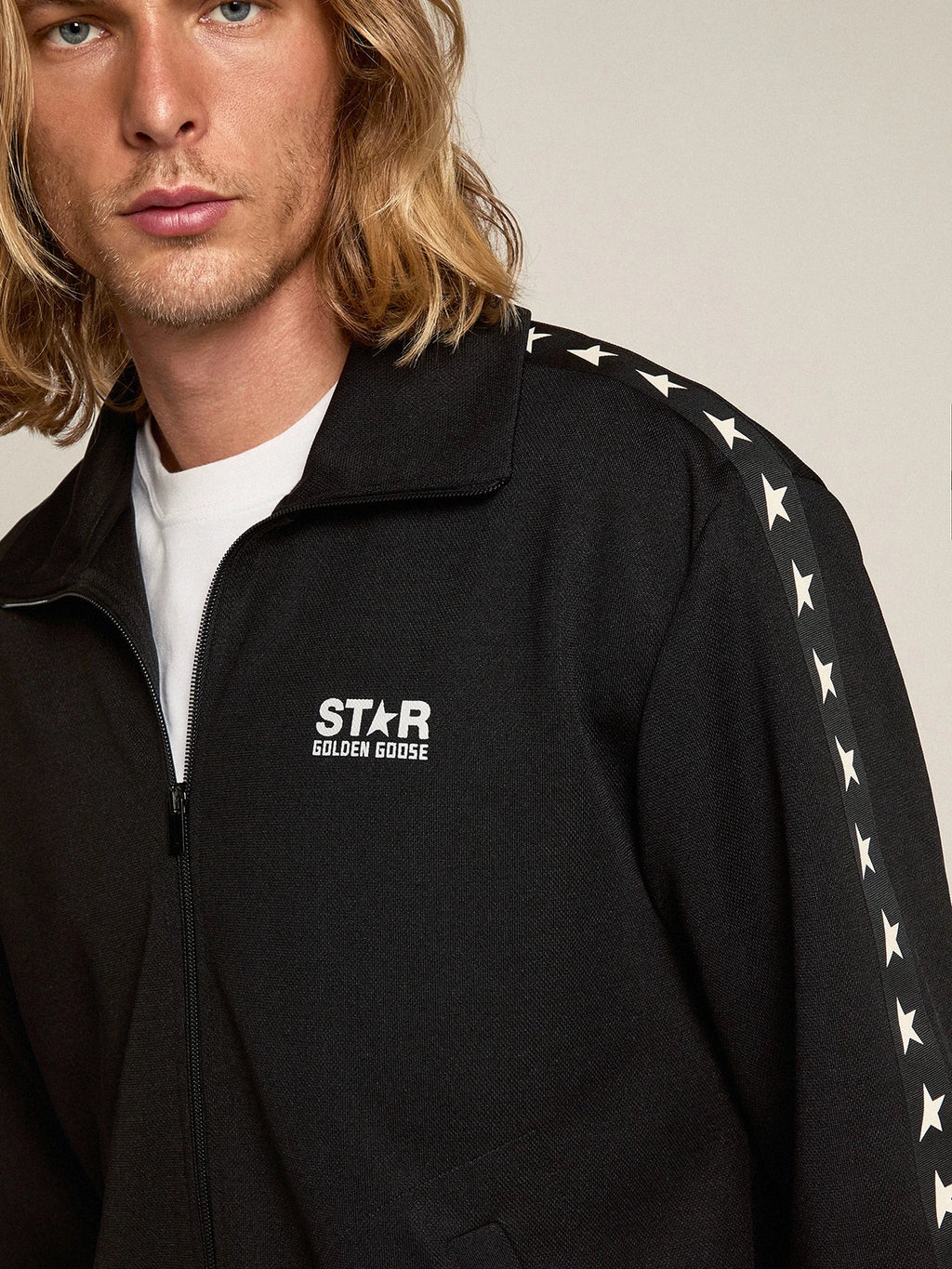 Felpa con zip da uomo di colore nero con stelle bianche a contrasto