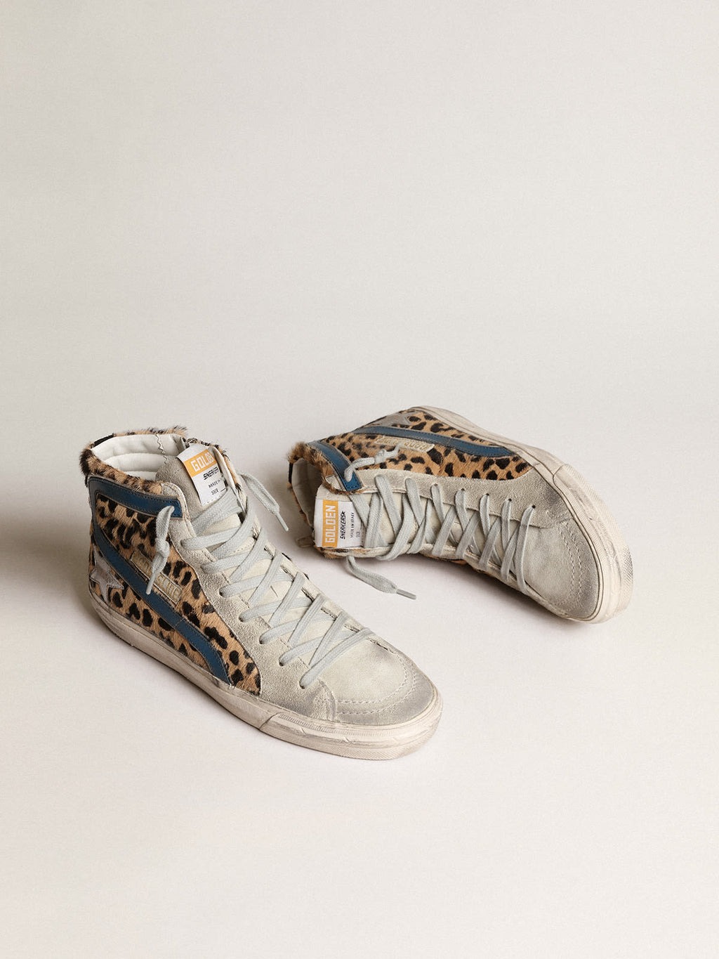 Slide in cavallino leopardato con stella in pelle laminata