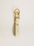 Worn white keyring