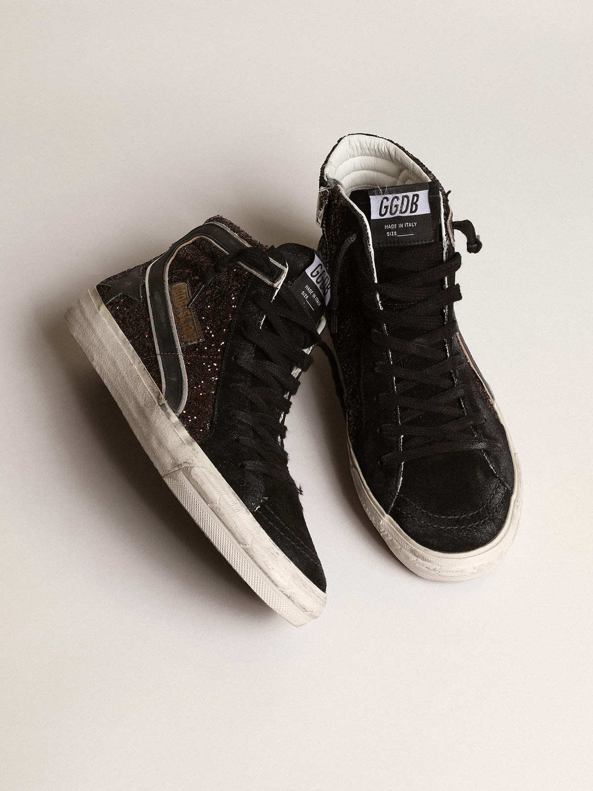 Slide in glitter marroni con stella e virgola in pelle nera