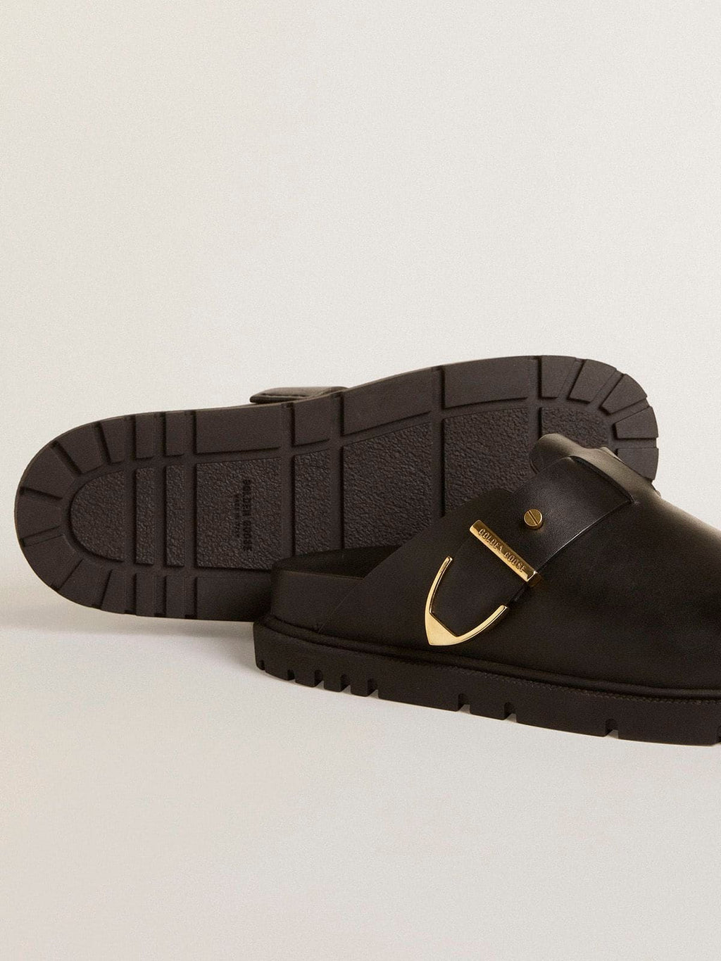 Women's Lucy Sabot in glossy black leather with gold metal buckle