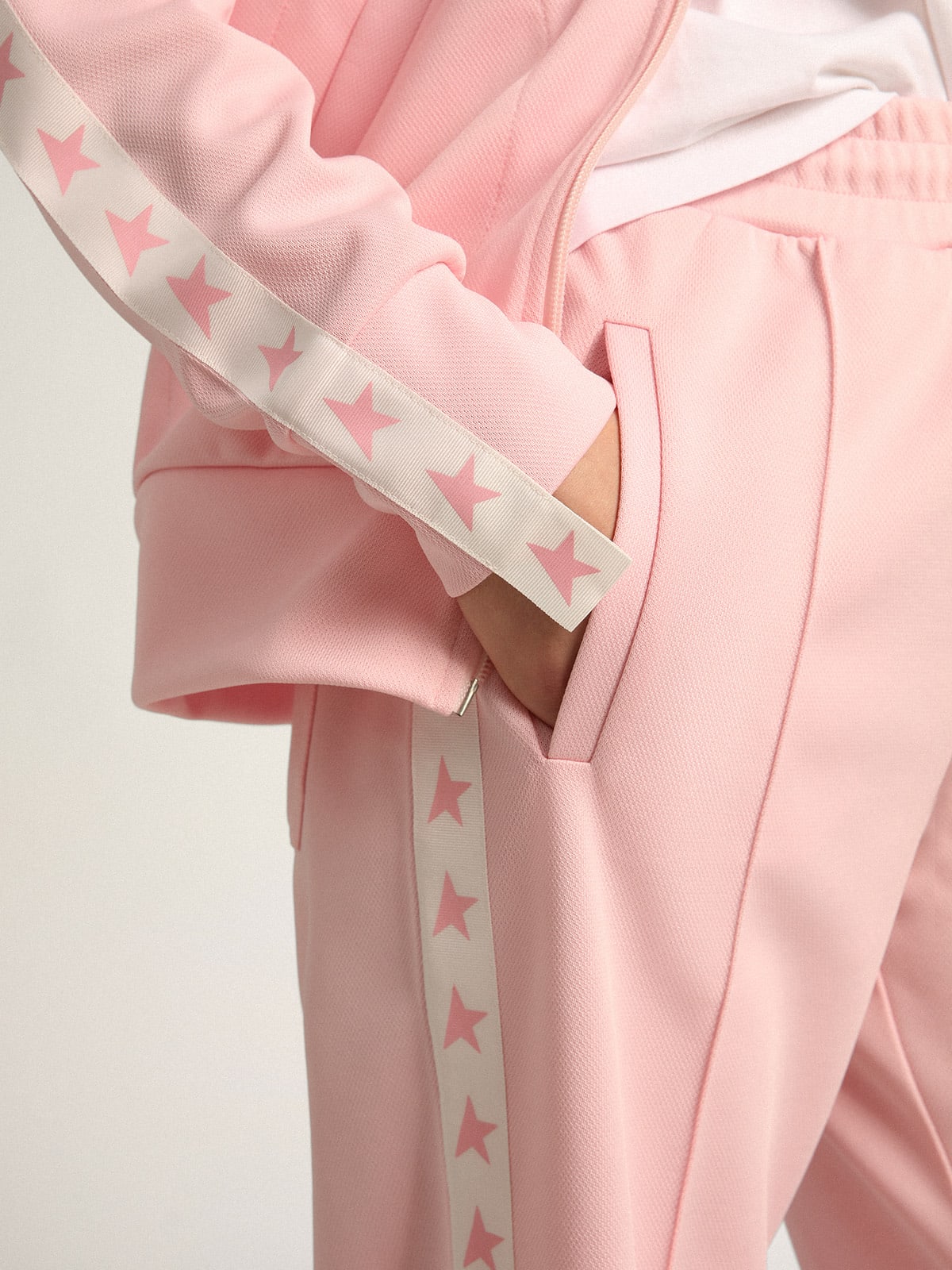Pantalone jogging da donna di colore rosa con stelle rosa sui lati