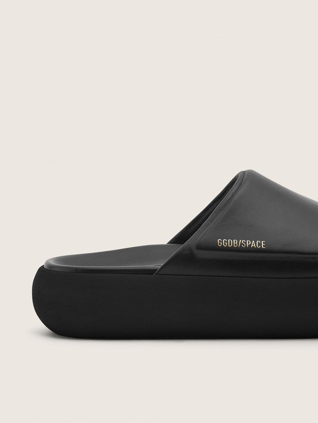 Women's Space-Star Slide slip-ons in black leather