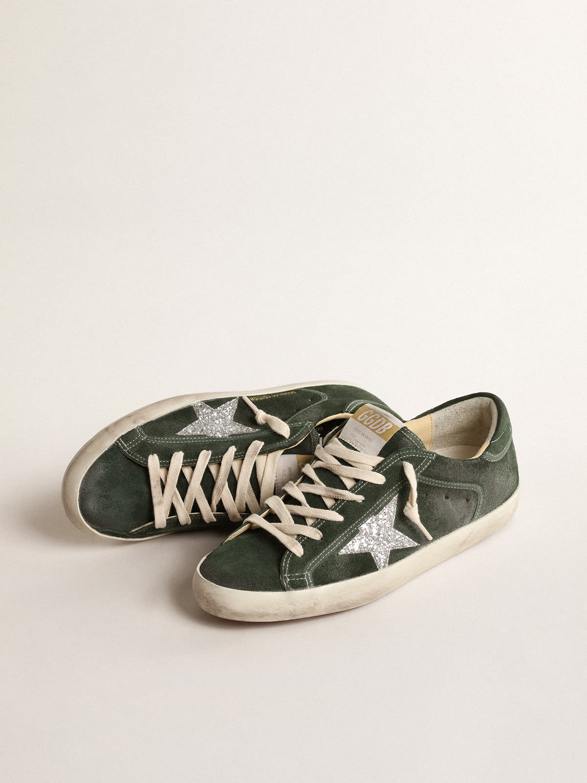 Super-Star LTD in suede verde con stella in glitter argento