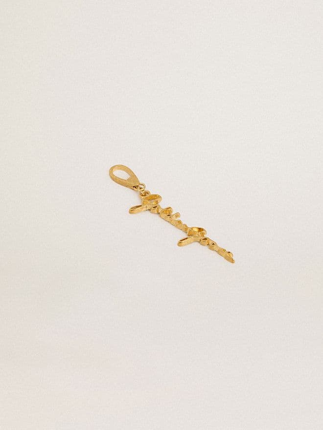 Gold-colored brass charm with Golden Goose signature