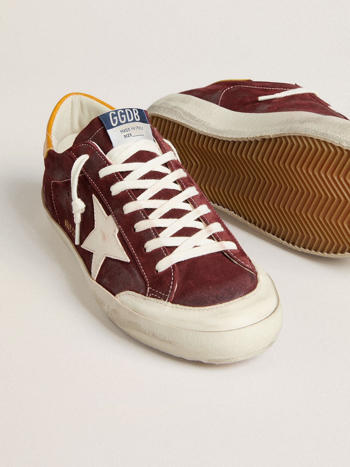 Men’s Super-Star in brick-red suede with white leather star and animal-print heel tab