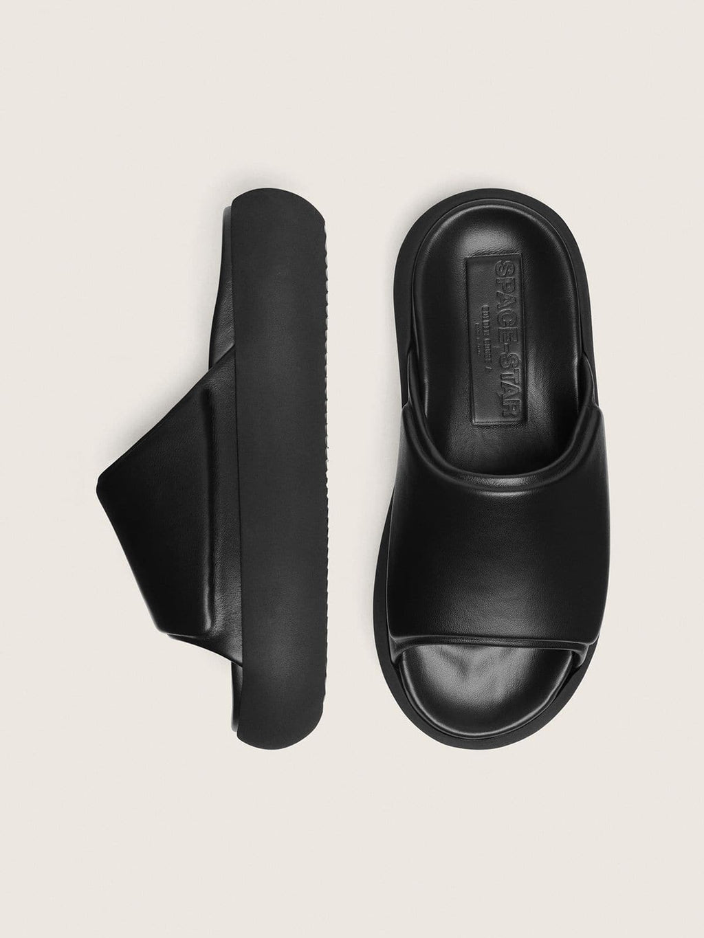 Women's Space-Star Slide slip-ons in black leather