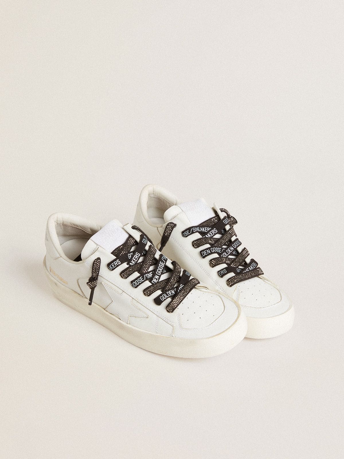 Black cotton laces with silver Swarovski crystals and white logo