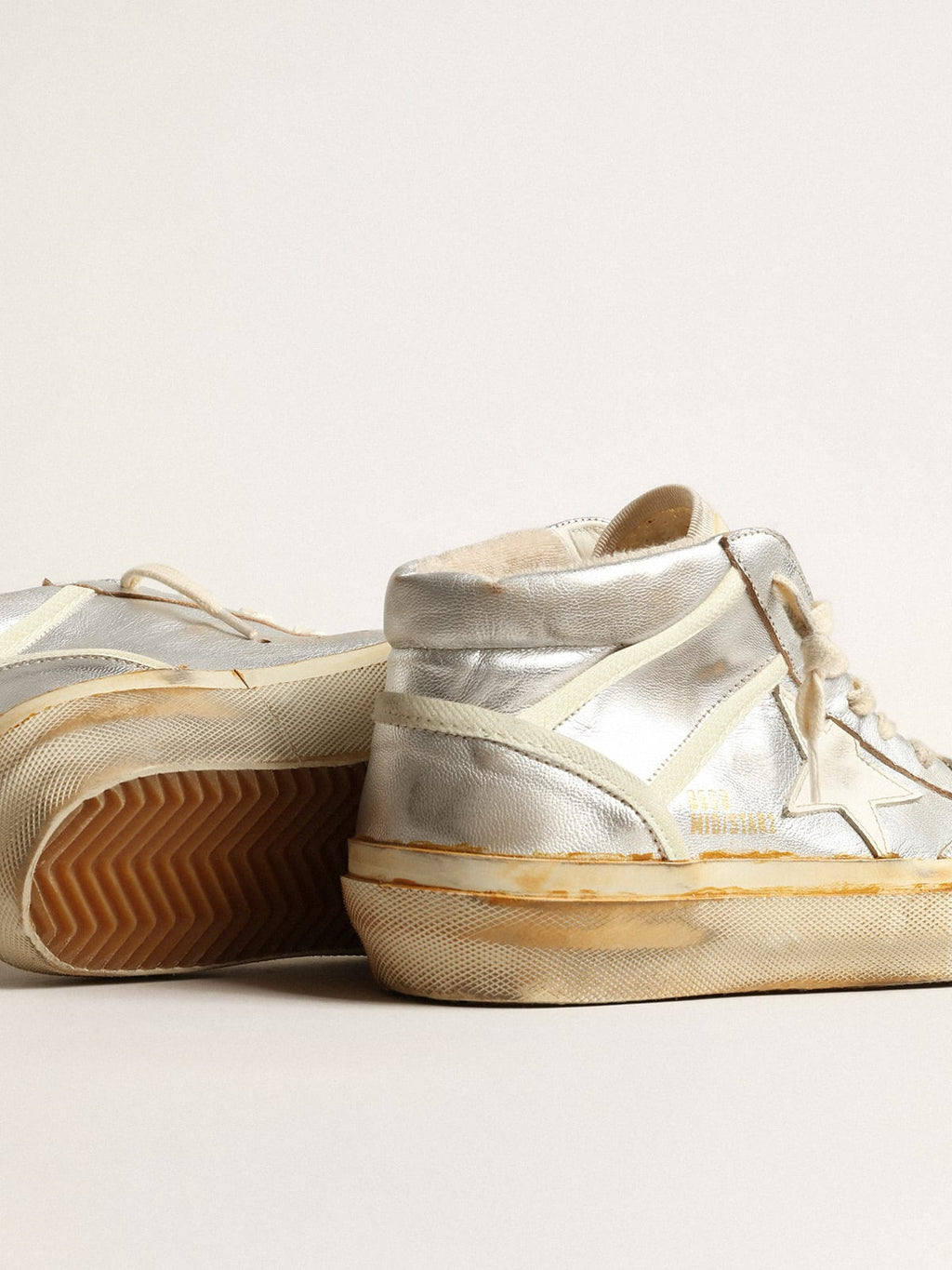 Mid Star Uomo in pelle laminata argento con stella color avorio