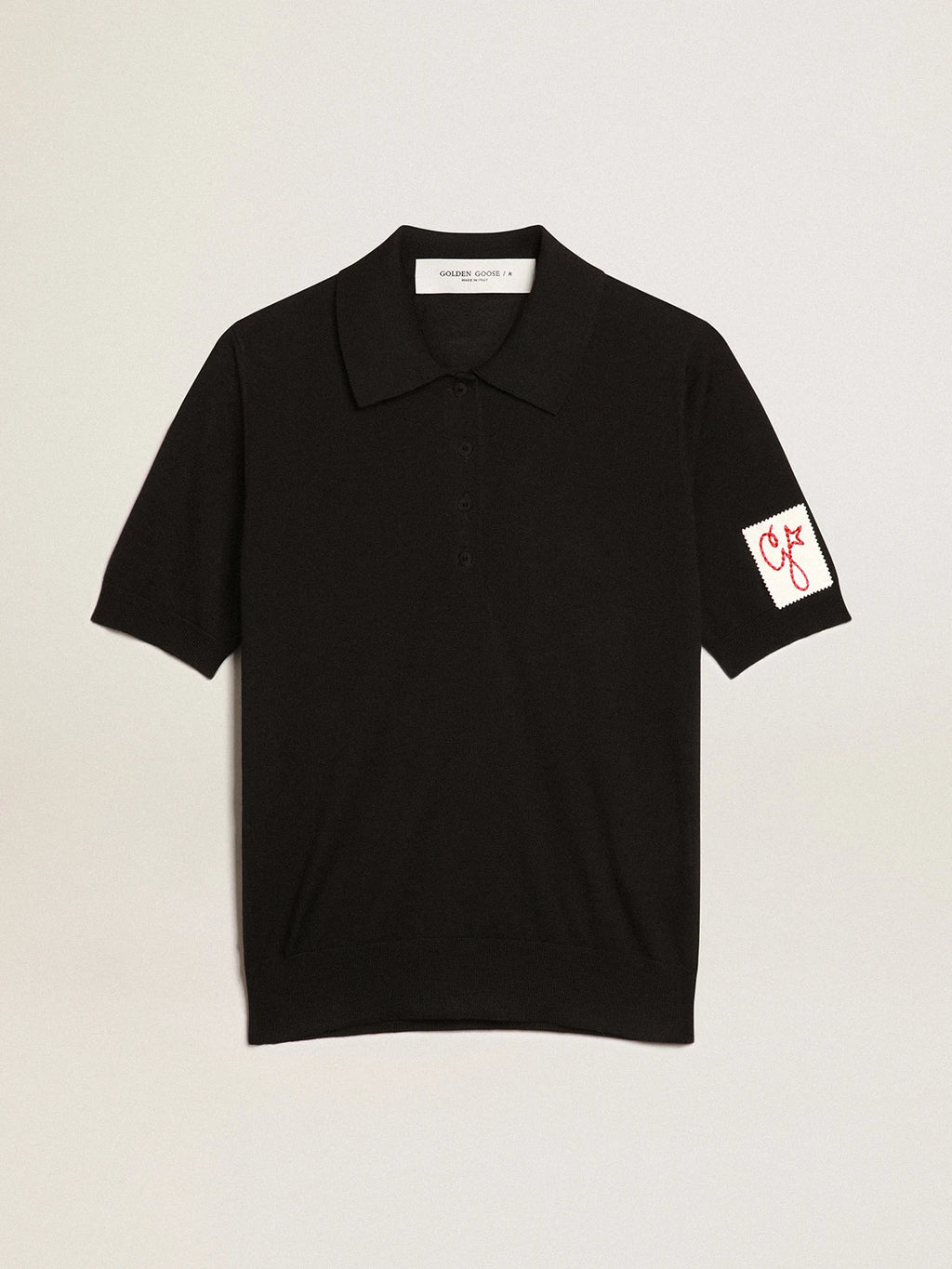 Polo da donna in lana merino di colore nero