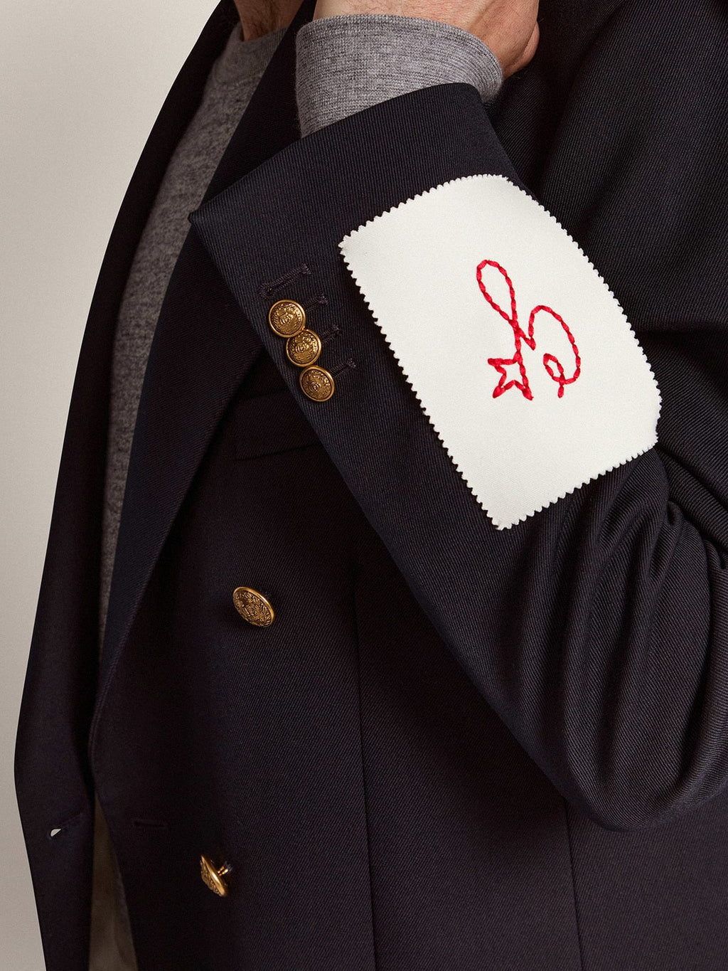 Blazer doppiopetto Collezione Golden di colore blu scuro con bottoni araldici dorati