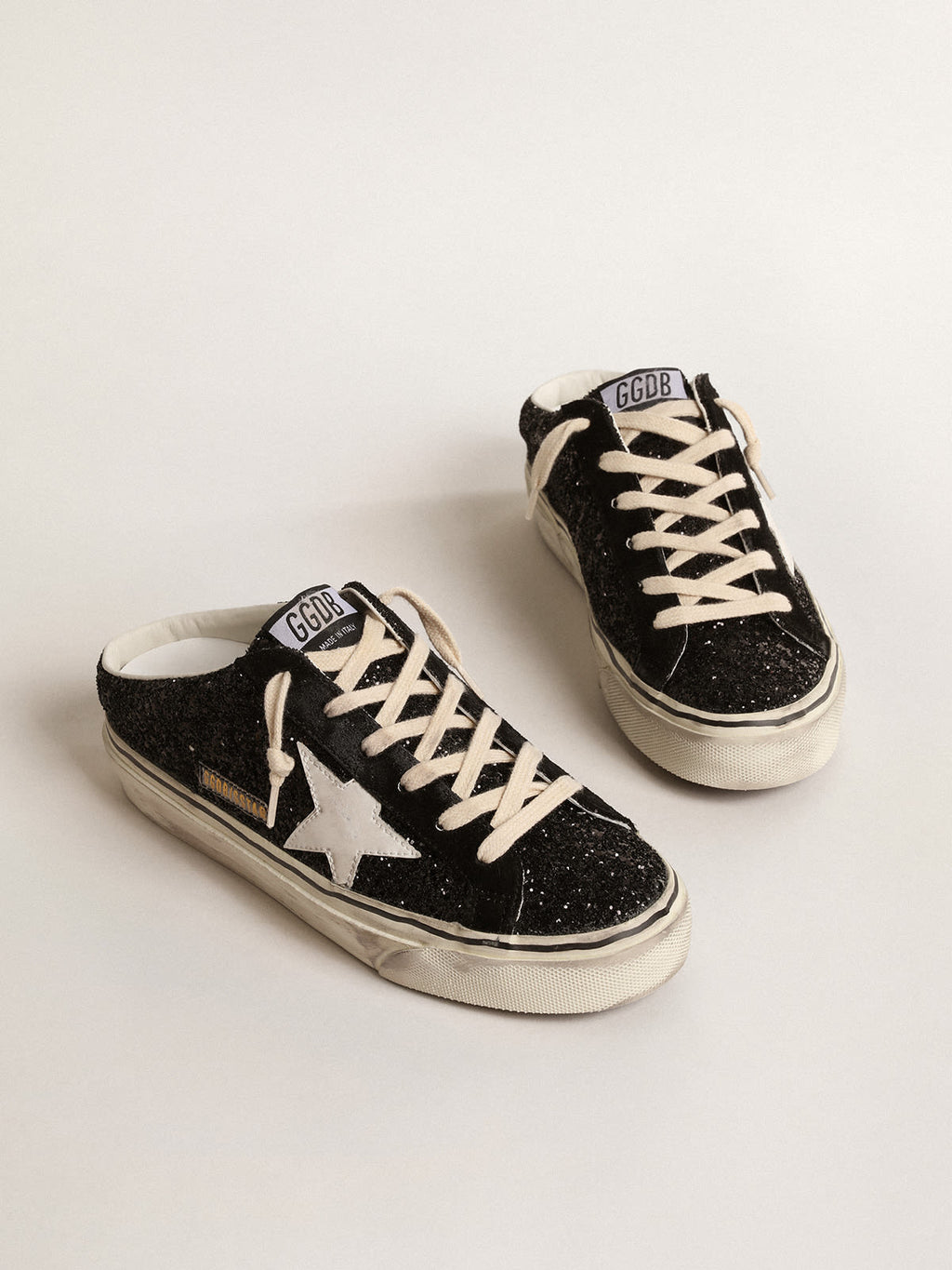 Super-Star Sabot in glitter neri con stella bio-based bianca