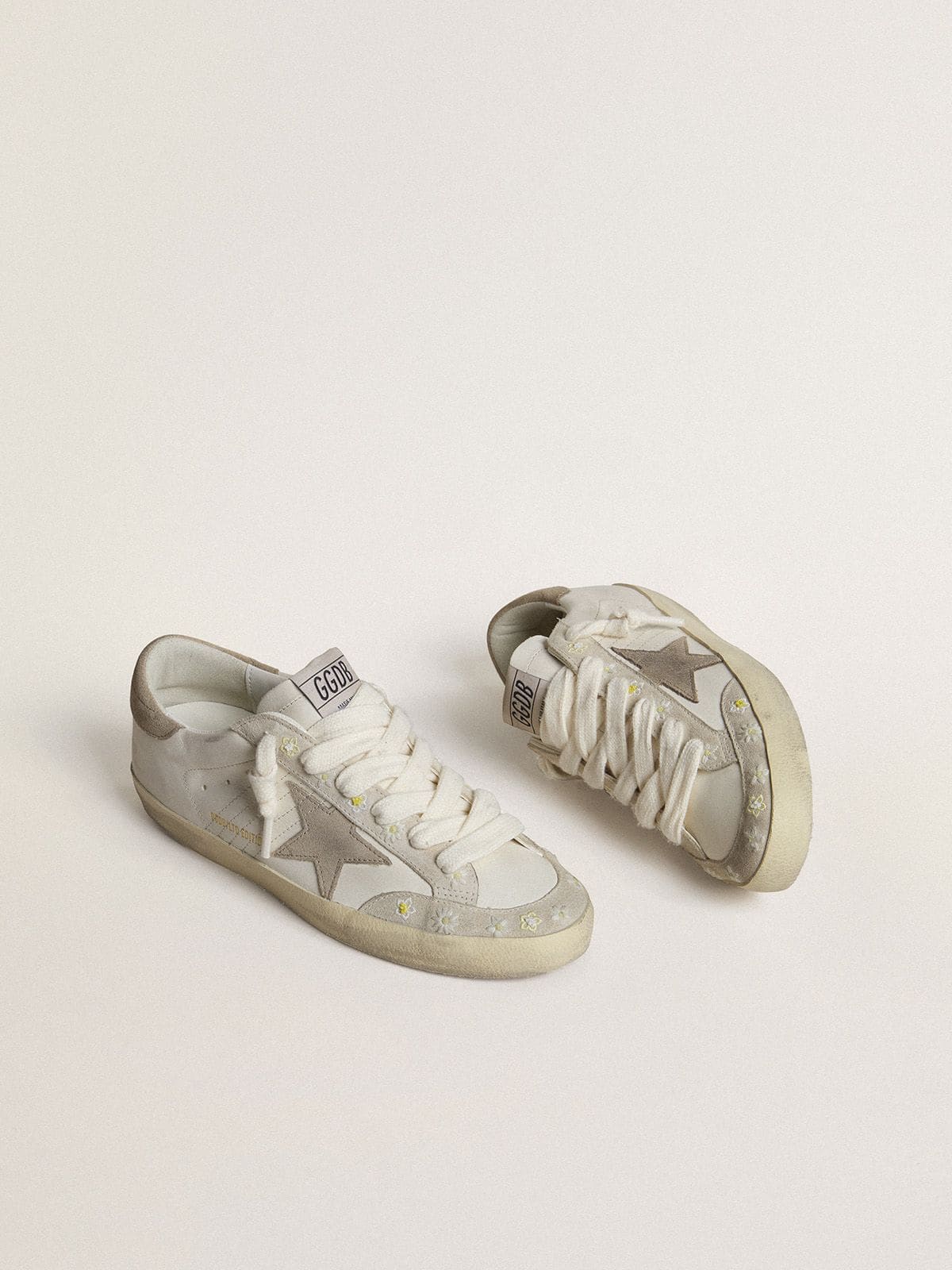Women’s Super-Star LTD with beige suede star and heel tab and floral embroidery